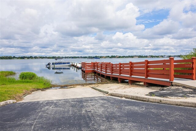 4177 N Orange Blossom Trl Unit 210, Orlando, FL 32804 - dock featuring a boat ramp and a water view