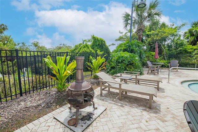 view of patio / terrace with a pool