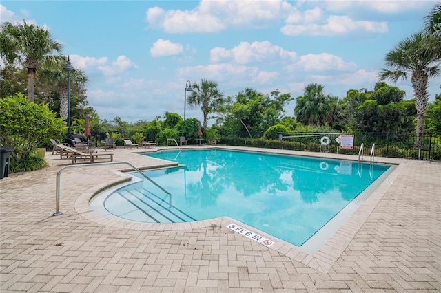 view of swimming pool with a patio area