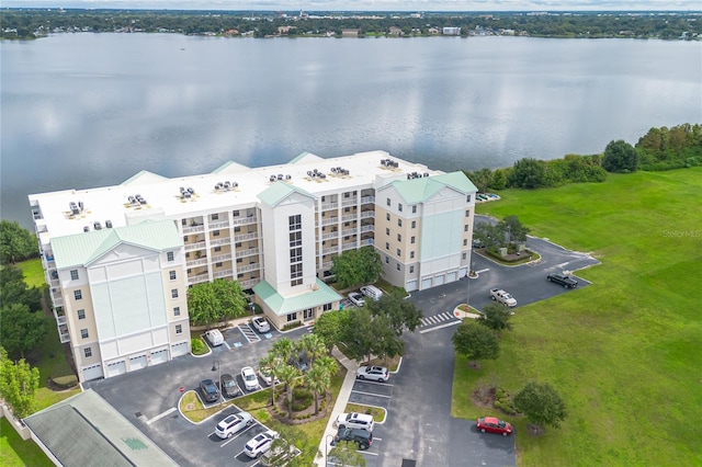 birds eye view of property with a water view