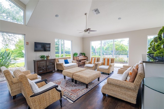 living room with vaulted ceiling, ceiling fan, and dark hardwood / wood-style floors