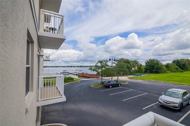 view of parking featuring a water view