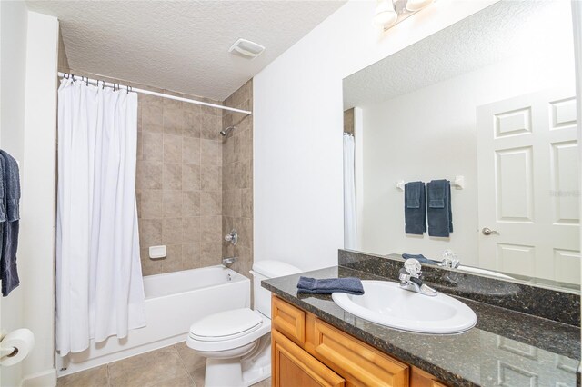 4177 N Orange Blossom Trl Unit 210, Orlando, FL 32804 - full bathroom featuring a textured ceiling, toilet, vanity, shower / tub combo, and tile patterned flooring