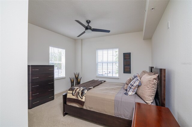 4177 N Orange Blossom Trl Unit 210, Orlando, FL 32804 - carpeted bedroom featuring multiple windows and a ceiling fan