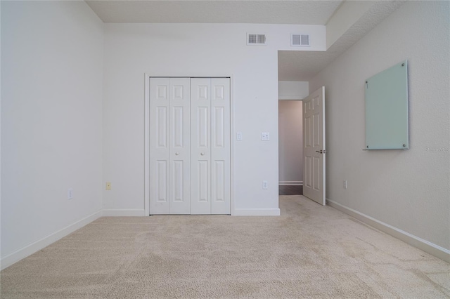 4177 N Orange Blossom Trl Unit 210, Orlando, FL 32804 - unfurnished bedroom with carpet floors, a closet, and baseboards