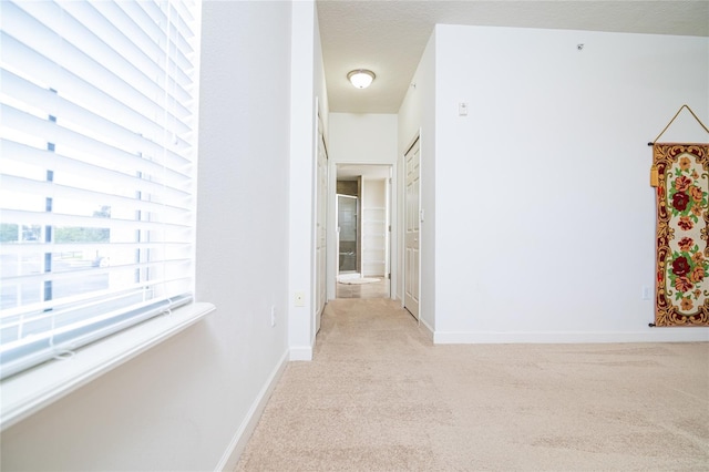 4177 N Orange Blossom Trl Unit 210, Orlando, FL 32804 - hall featuring light colored carpet and baseboards