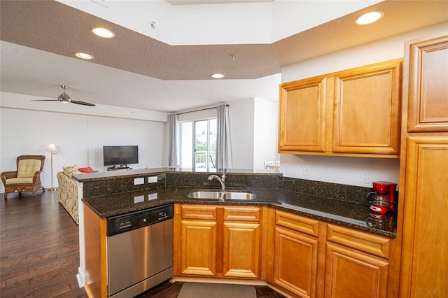 4177 N Orange Blossom Trl Unit 210, Orlando, FL 32804 - kitchen featuring stainless steel dishwasher, a sink, recessed lighting, open floor plan, and a peninsula