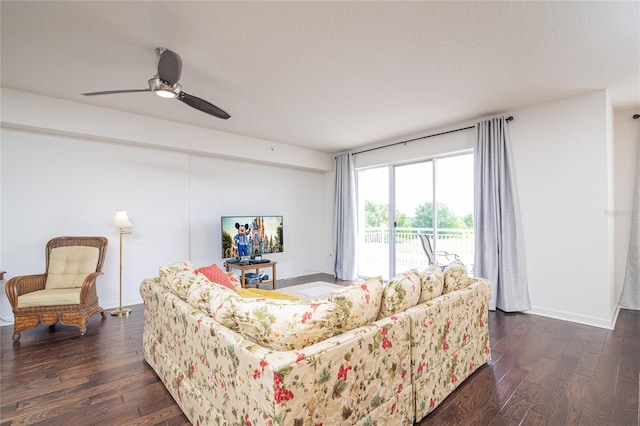 living room with ceiling fan and dark hardwood / wood-style flooring