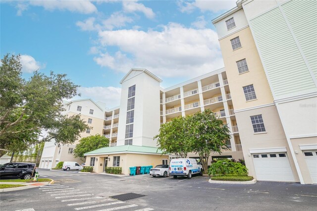 4177 N Orange Blossom Trl Unit 210, Orlando, FL 32804 - view of apartment building / complex with uncovered parking