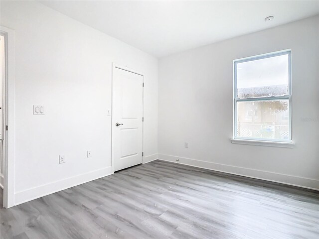 spare room with light hardwood / wood-style floors