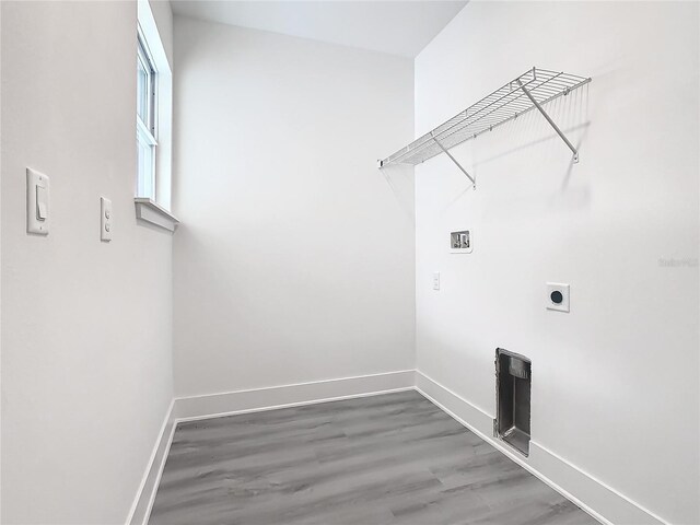 washroom with hardwood / wood-style floors, electric dryer hookup, and hookup for a washing machine