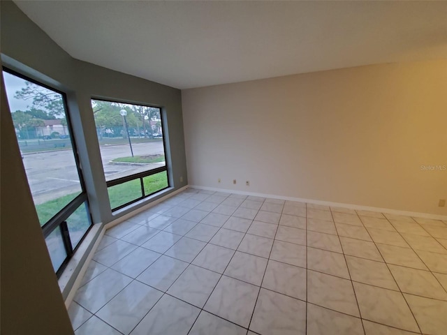 empty room with light tile patterned floors