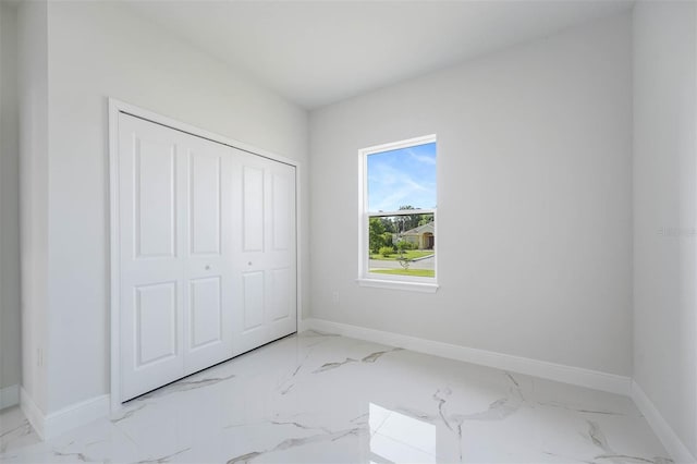 unfurnished bedroom with a closet