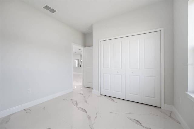 unfurnished bedroom featuring a closet