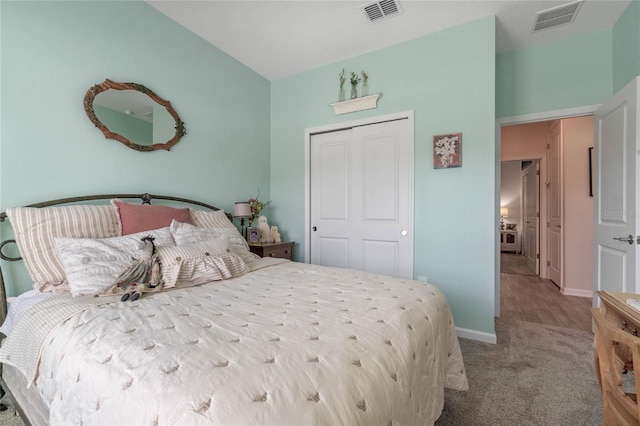 carpeted bedroom featuring a closet