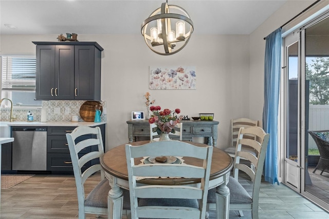 dining room featuring light hardwood / wood-style floors and an inviting chandelier