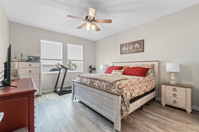 bedroom featuring wood-type flooring and ceiling fan