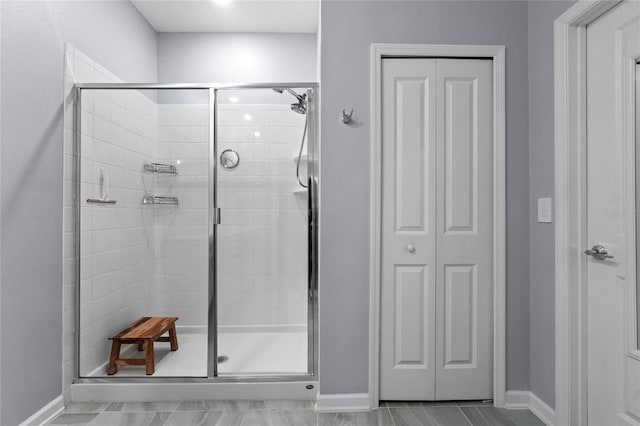 bathroom featuring an enclosed shower