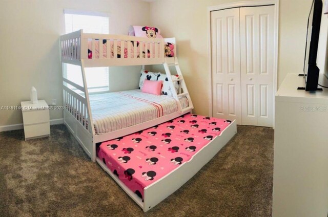 carpeted bedroom featuring a closet