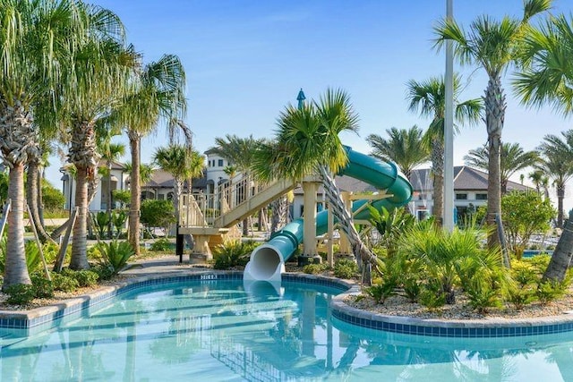 view of pool with a water slide