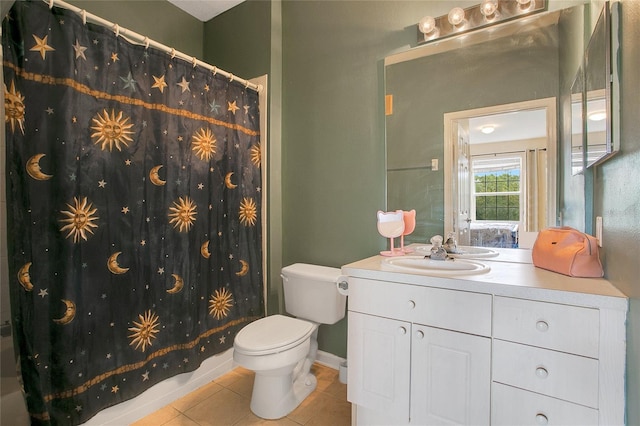 full bathroom featuring shower / bath combination with curtain, vanity, tile patterned flooring, and toilet