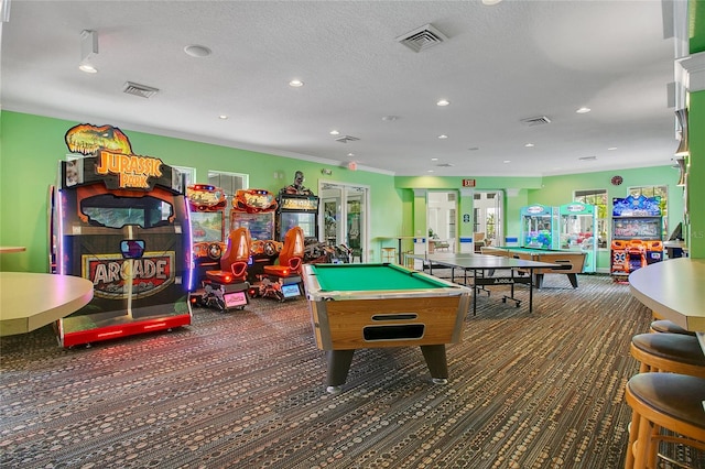 rec room featuring dark carpet, a textured ceiling, and billiards