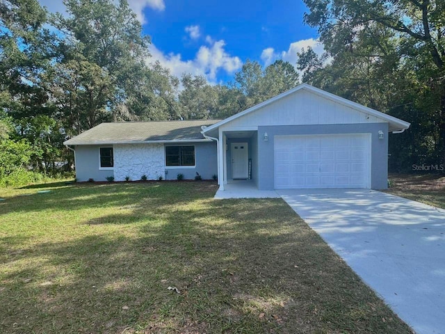 ranch-style home featuring a front lawn and a garage