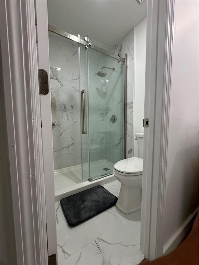 bathroom with walk in shower and toilet