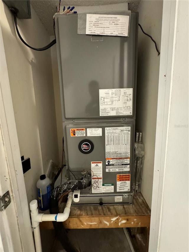 utility room with heating unit