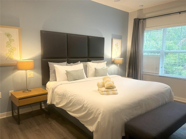 bedroom with wood-type flooring