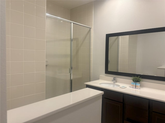 bathroom with vanity and an enclosed shower