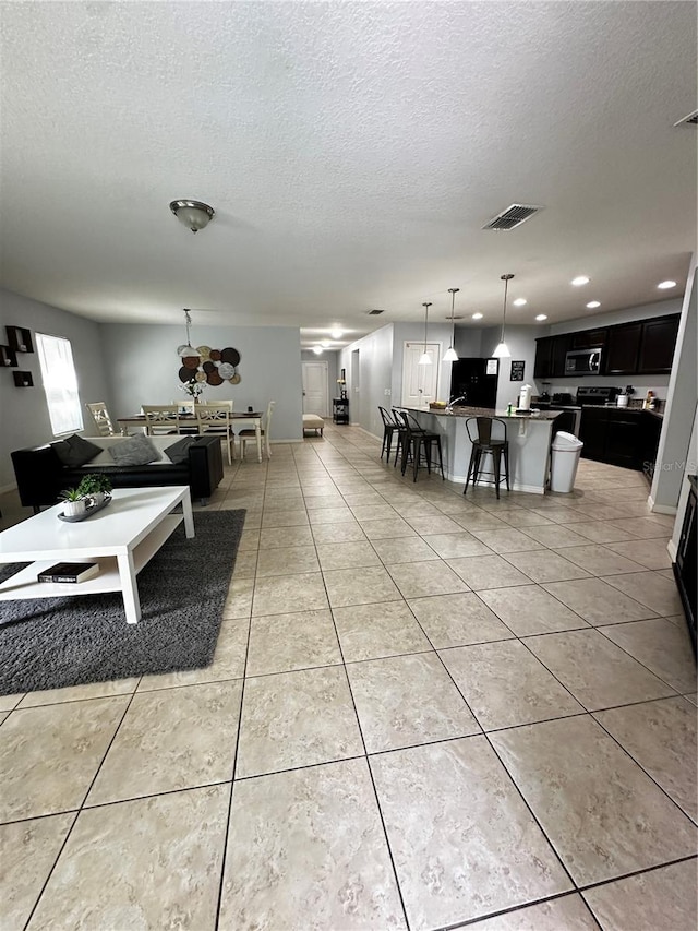 interior space featuring a textured ceiling