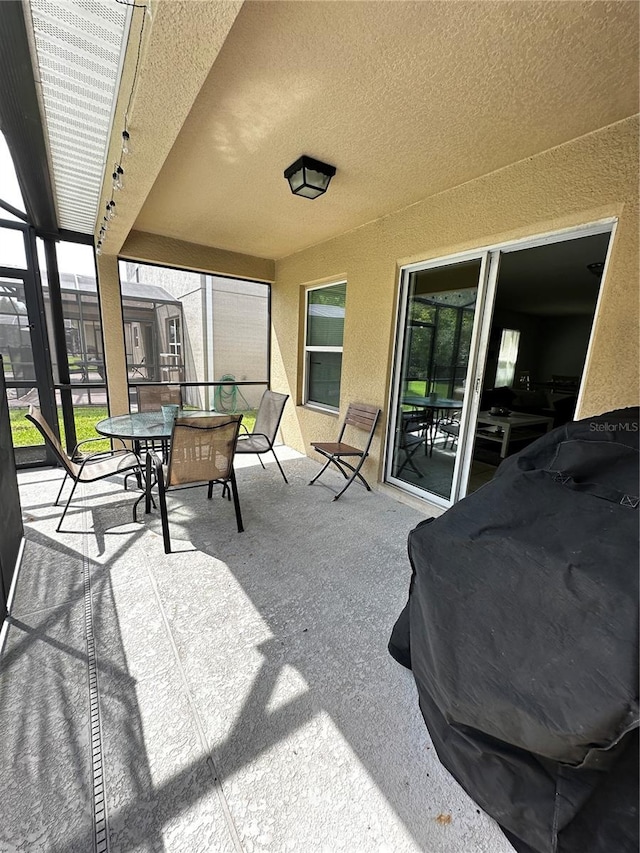 view of patio / terrace with a lanai