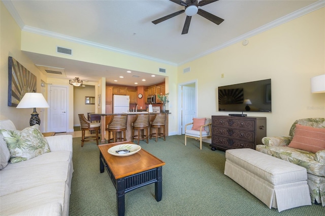 carpeted living room with ornamental molding and ceiling fan