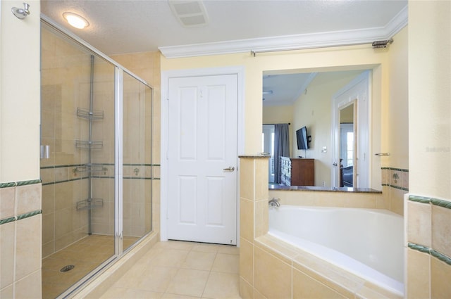 bathroom with tile patterned flooring, a textured ceiling, independent shower and bath, and crown molding