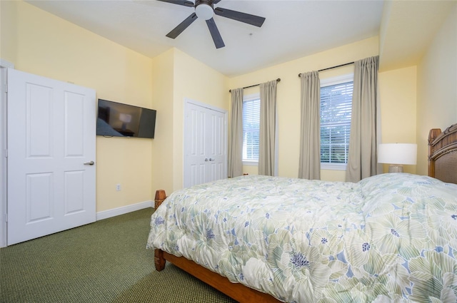 carpeted bedroom with ceiling fan and a closet