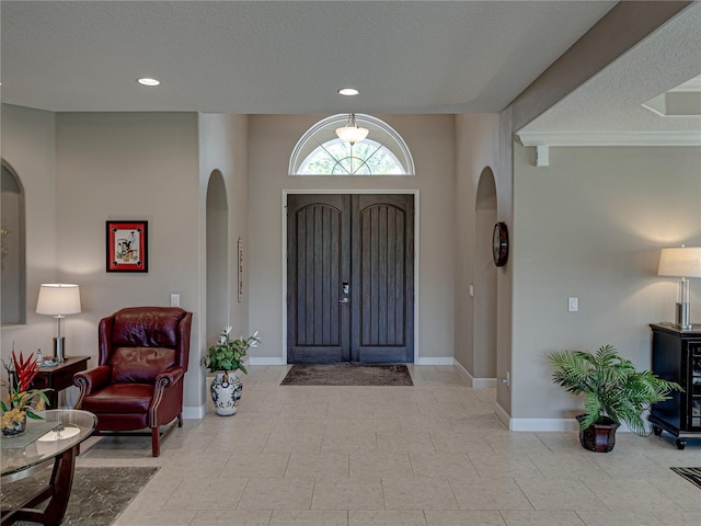 entryway featuring a textured ceiling