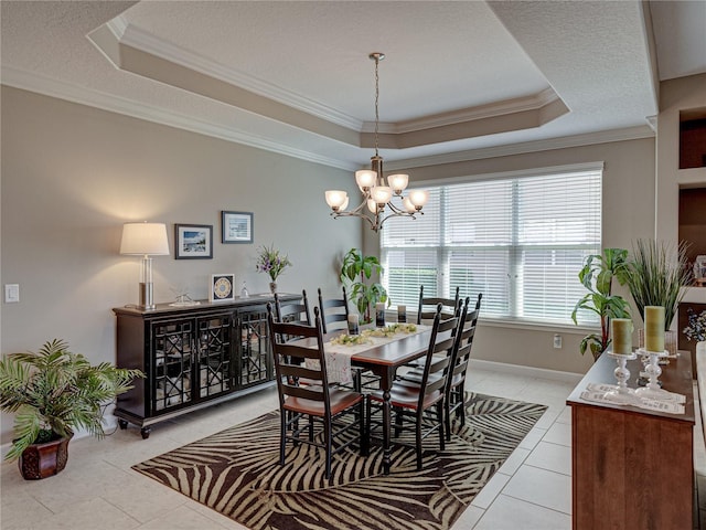 tiled dining room with ornamental molding, a textured ceiling, a tray ceiling, and a chandelier