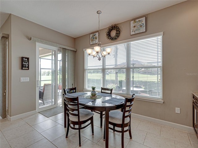 dining room featuring a wealth of natural light, a chandelier, and light tile patterned floors