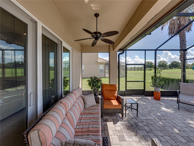 sunroom / solarium with ceiling fan