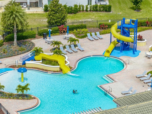 view of pool featuring a patio and a water slide