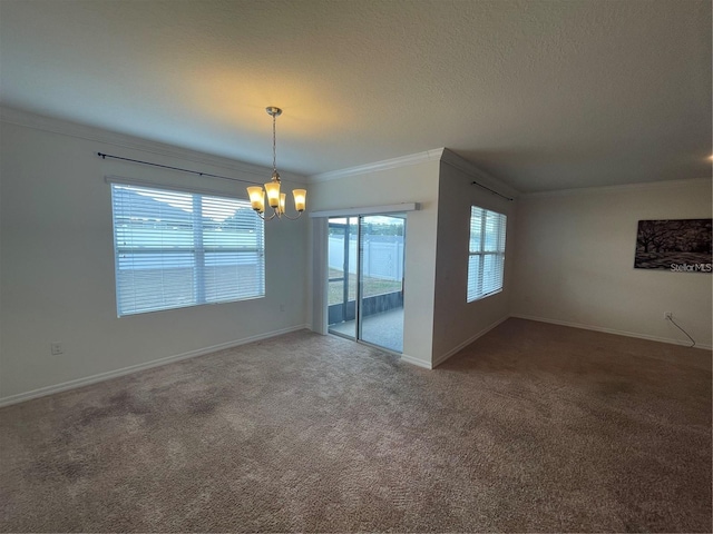 unfurnished room with crown molding, carpet flooring, and a wealth of natural light