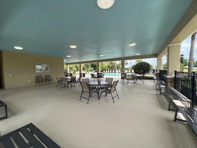 view of patio with a swimming pool