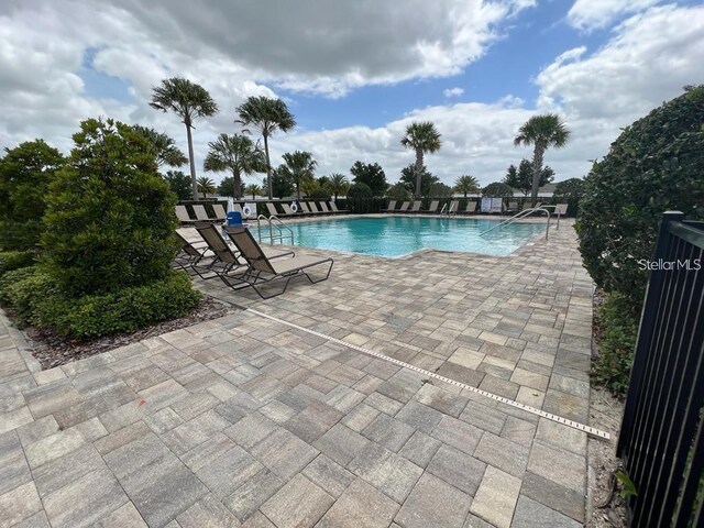 view of pool featuring a patio area