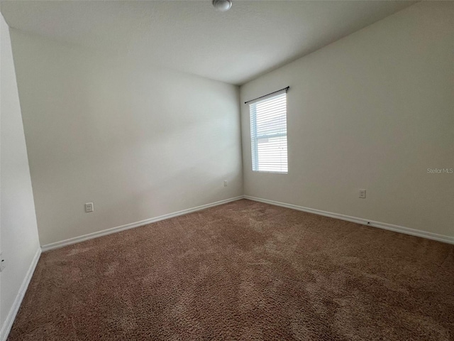 spare room with carpet flooring