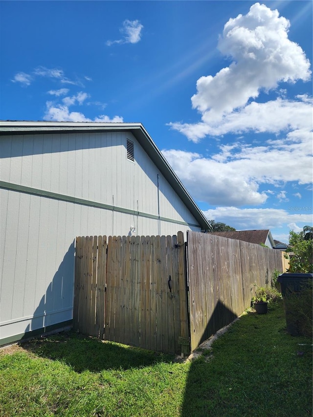 view of side of property with a yard