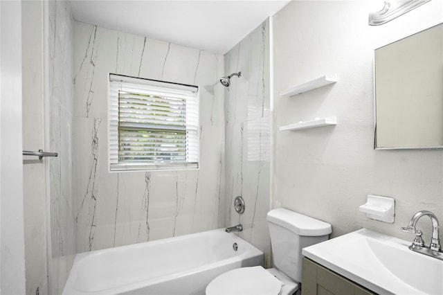 full bathroom with vanity, toilet, and tiled shower / bath