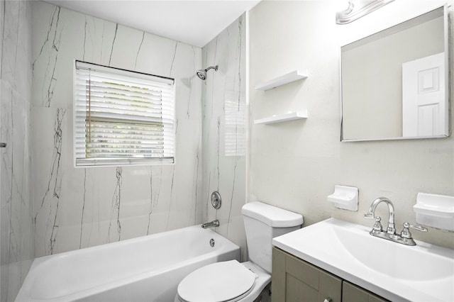 full bathroom featuring tiled shower / bath, vanity, and toilet