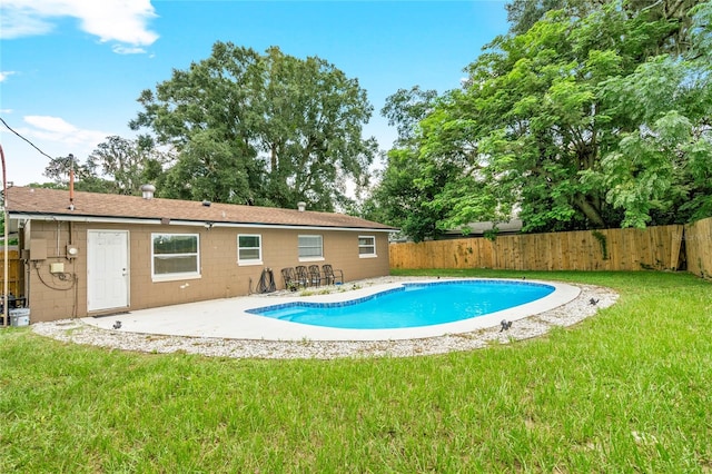 view of pool with a yard and a patio area