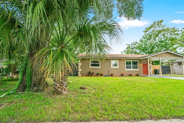 ranch-style house with a front lawn and a carport